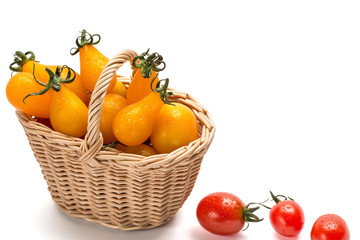 Fototapeta na wymiar Red tomatoes in basket isolated on white background