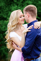 Fototapeta premium guy and girl are hugging in the Park.