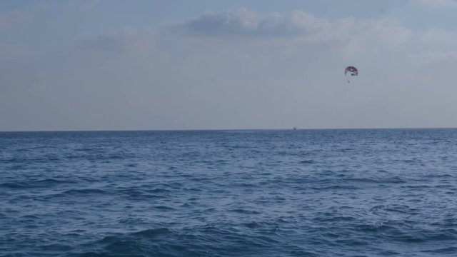 Paragliding in the sky above the sea