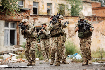 Army sniper team during the military operation in the city. war, army, technology and people...