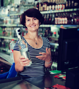 Ederly Woman Cashier At Store