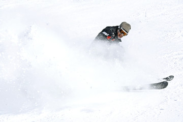 skier in a whirlwind of snow