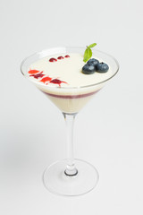 Panna cotta with fresh blueberries and mint, layered with jam