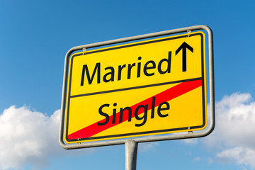 Yellow street sign with Married ahead leaving Single behind