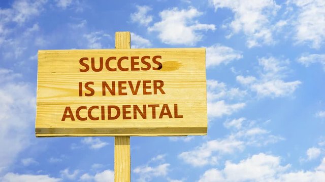 Success is never accidental. Words on a wooden sign against time lapse clouds in the blue sky. 
