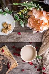 Cup of coffee on the wood with flower