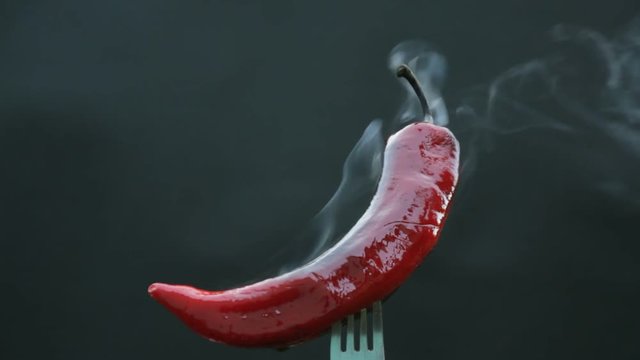 hot pepper on a fork smokes