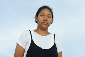 Portrait of Asian girl, Thai girl on blue background