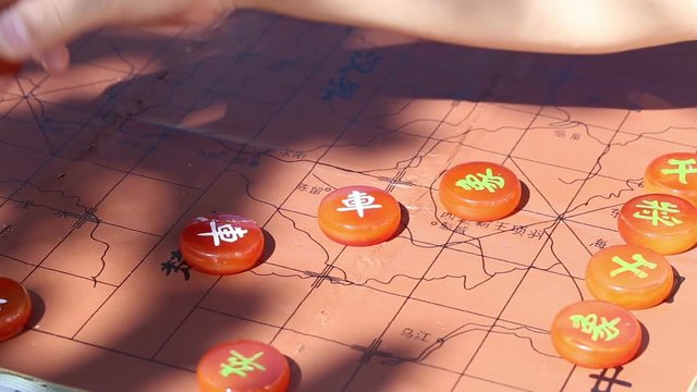 Playing Chinese chess in the afternoon.  The shadow of leaves. And the background of chess map graphics -- CHU HE HAN JIE.