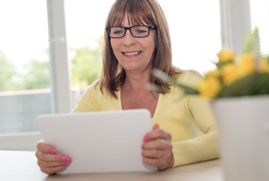 Mature woman using a tablet