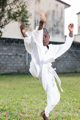 young child practicing karate © vystekimages