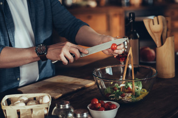 man cooking vegetable salad