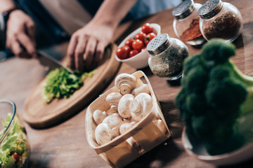 man cooking vegetable salad