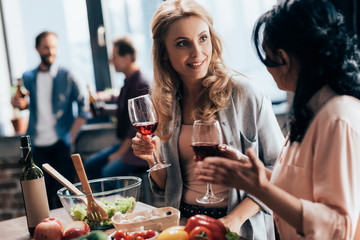 female friends drinking wine