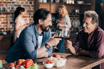 male friends drinking wine