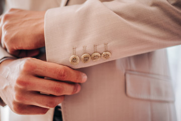 Buttons on a beige jacket