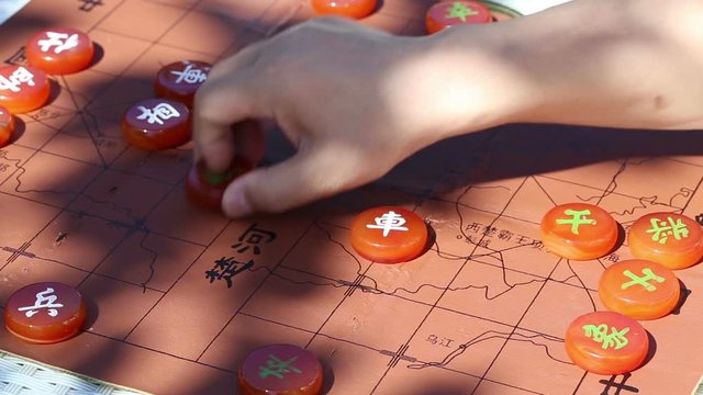 Playing Chinese chess in the afternoon.  The shadow of leaves. And the background of chess map graphics -- CHU HE HAN JIE.