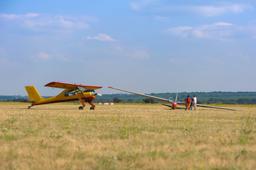 Naklejka na ściany i meble Sailplane and a towing aircraft starting on an airfield