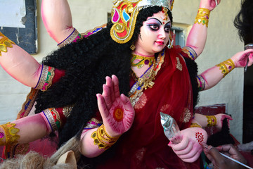 Artisan of West Bengal making clay idol of Godess Durga ahed of Durga festival