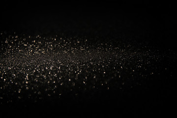glitter vintage lights background. light silver and black. defocused