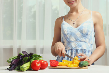 girl prepares a vegetable salad
