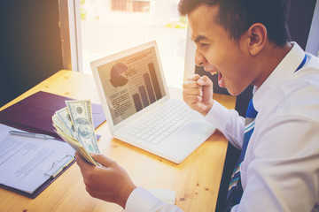 Businessman with stylus pen touching the screen of smart phone and discuss with business partner