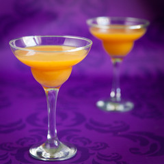 Peach jelly on vibrant violet background