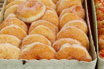 A lot of donut and strawberry jam