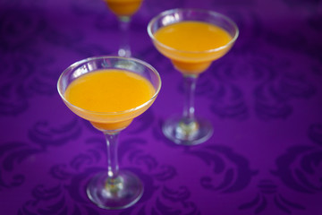 Peach jelly on vibrant violet background