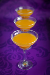 Peach jelly on vibrant violet background