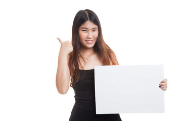 Young Asian woman show thumbs up with  white blank sign.