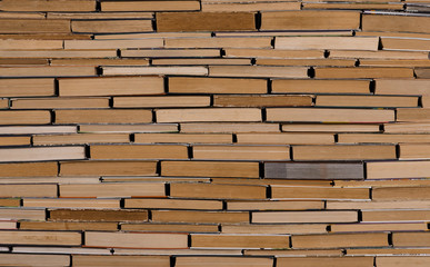 old books wall pattern, stack of aged books texture