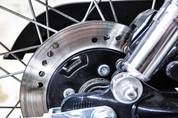Fototapeta na wymiar Disc brake system of motorcycle close-up