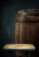 Beer barrel with glasses on table wooden background