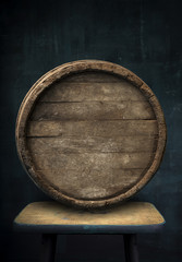 Beer barrel with glasses on table wooden background
