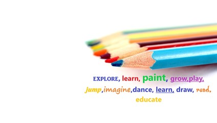 Color pencils and motivational words on white background 