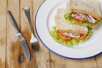 Fresh homemade club sandwich with lettuce and tomato