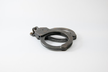 Old Police handcuffs isolated on white background