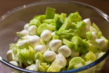 Fresh salad with cucumbers and white cheese balls