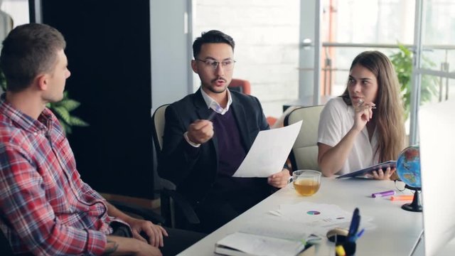 Group of young business people working together in creative office