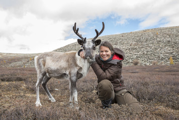 woman and her reindeer in northern Mongolia