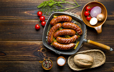 Delicious roasted sausage on wood
