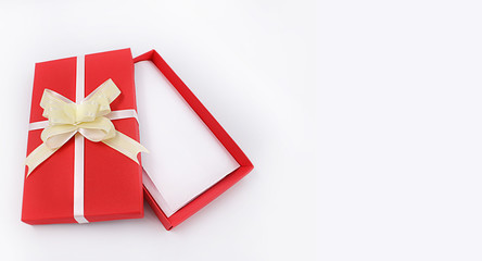 red gift box with bow on white background