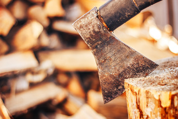 closeup old ax on firewood background