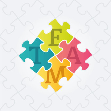 Four jigsaw puzzle pieces with team word