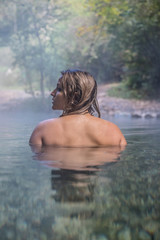 Young Woman Taking a Bath In Hot Spring Outdoor Maibachl Villach Austria