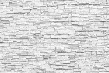 Obraz premium Powierzchnia biała ściana szarych ścian kamiennej ściany do wykorzystania jako tło. Nowy projekt nowoczesnej kamiennej ściany. wzór dekoracyjnej powierzchni kamiennej ściany.