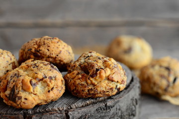 Homemade nut biscuits on a wooden background. Sweet pastry with walnuts. Closeup