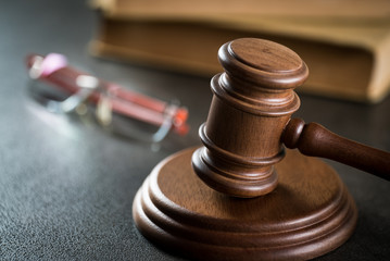 Gavel and Glasses on the book