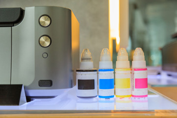 Printers and empty ink bottles.
